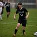 Huron sophomore Brenna Barton handles the ball in the game on Tuesday, April 23. Daniel Brenner I AnnArbor.com